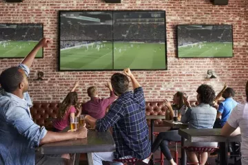 Depositphotos 156591650 stock photo friends watching game