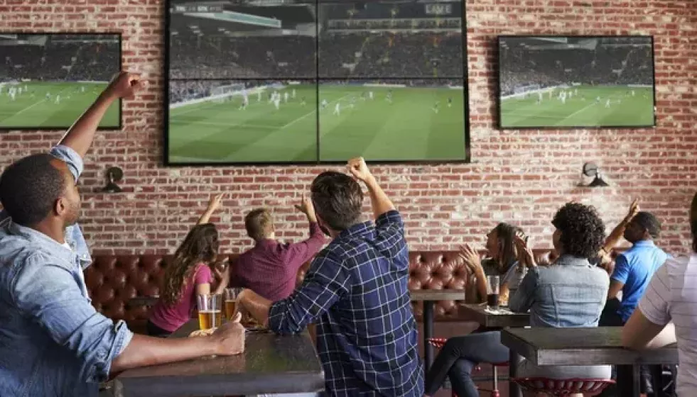 Depositphotos 156591650 stock photo friends watching game