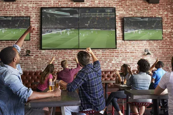 Depositphotos 156591650 stock photo friends watching game