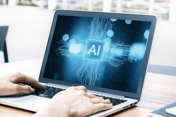 Archivo - Ordenador Portátil con las siglas AI (Inteligencia Artificial).